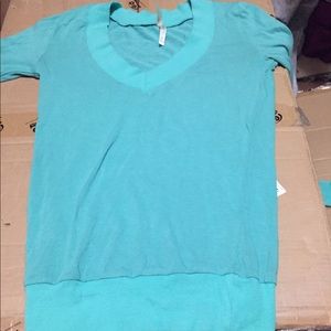 Two long sleeve sweaters